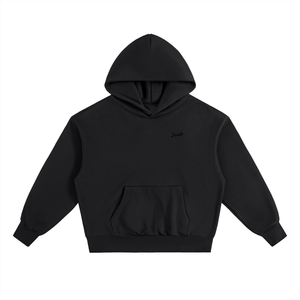 Front view of black Sabr oversized fleece hoodie with subtle Arabic chest design