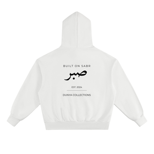 Back view of white Sabr oversized fleece hoodie with black Arabic calligraphy and Dunya Collections branding